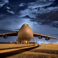 Aircraft Sleeping at under a full moon